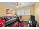 Cozy den with a comfortable couch and exercise equipment at 307 E Jackson St, Mebane, NC 27302