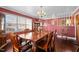 Spacious dining room with hardwood floors and a large wooden table at 307 E Jackson St, Mebane, NC 27302