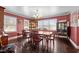 Bright dining room featuring hardwood floors and a classic dining set at 307 E Jackson St, Mebane, NC 27302