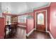 Formal dining room with hardwood floors and built-ins at 307 E Jackson St, Mebane, NC 27302