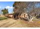 Brick house with mature trees and yard at 307 E Jackson St, Mebane, NC 27302