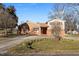 Two story brick home with a driveway at 307 E Jackson St, Mebane, NC 27302