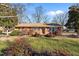 Brick ranch house with a spacious yard at 307 E Jackson St, Mebane, NC 27302