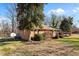 Brick house with a large yard and shed at 307 E Jackson St, Mebane, NC 27302