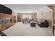 Large living room with brick fireplace and ample natural light at 307 E Jackson St, Mebane, NC 27302