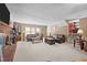 Living room with brick fireplace, comfortable seating, and large windows at 307 E Jackson St, Mebane, NC 27302