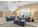 A cozy living room features blue sofas, an ottoman, and a decorative rug at 327 Davis Love Dr, Chapel Hill, NC 27517