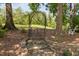 Landscaped yard with stone steps leading to an archway at 327 Davis Love Dr, Chapel Hill, NC 27517