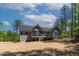 Picturesque backyard with a screened porch, deck, and lush green trees offering privacy at 3925 Cedar Knolls Dr, Youngsville, NC 27596