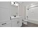 Clean bathroom features a vanity with black hardware and a tub with a shower at 3925 Cedar Knolls Dr, Youngsville, NC 27596