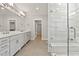 Bathroom features a double sink vanity and a glass-enclosed walk-in shower at 3925 Cedar Knolls Dr, Youngsville, NC 27596