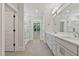 Bright bathroom with a double sink vanity, walk-in glass shower, and natural light at 3925 Cedar Knolls Dr, Youngsville, NC 27596