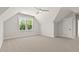 Bonus room featuring neutral carpet, trim, and window at 3925 Cedar Knolls Dr, Youngsville, NC 27596