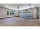 Spacious garage featuring a large garage door and natural lighting at 3925 Cedar Knolls Dr, Youngsville, NC 27596