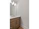 This powder room is equipped with a designer mirror, sink, and vanity at 3925 Cedar Knolls Dr, Youngsville, NC 27596