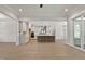 Open floor plan displaying an elegant kitchen with an island and modern lighting at 3925 Cedar Knolls Dr, Youngsville, NC 27596
