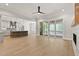 Spacious living area with a view of the kitchen, and access to a screened porch at 3925 Cedar Knolls Dr, Youngsville, NC 27596