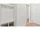 Bright mudroom features convenient storage bench and access to a half bathroom at 3925 Cedar Knolls Dr, Youngsville, NC 27596