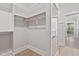 Large walk-in closet boasting custom shelving and hardwood floors, providing ample storage at 3925 Cedar Knolls Dr, Youngsville, NC 27596
