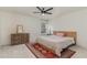 Bright bedroom featuring an area rug, ceiling fan, and dresser at 40 Ironwood Blvd, Youngsville, NC 27596