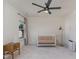 Bedroom featuring neutral walls, gray carpet, a ceiling fan, and a baby crib at 40 Ironwood Blvd, Youngsville, NC 27596