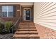 Inviting front entrance with brick stairs and decorative wreath on the door at 40 Ironwood Blvd, Youngsville, NC 27596