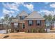 Beautiful two-story home featuring a brick facade, well-maintained landscaping, and inviting curb appeal at 40 Ironwood Blvd, Youngsville, NC 27596