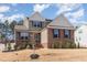 Charming two-story home with a brick facade, complemented by neatly landscaped front yard at 40 Ironwood Blvd, Youngsville, NC 27596