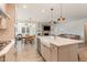 An open-concept kitchen offers a spacious island with a sink and views of the dining and living areas at 40 Ironwood Blvd, Youngsville, NC 27596