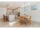 Bright kitchen with white cabinets, stainless steel appliances, and an adjacent dining area at 40 Ironwood Blvd, Youngsville, NC 27596