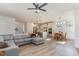 Open-concept living space featuring a kitchen, dining area, and living room with abundant natural light at 40 Ironwood Blvd, Youngsville, NC 27596