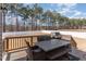 Back patio featuring dining set, grill, and a view of the backyard at 40 Ironwood Blvd, Youngsville, NC 27596