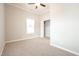 Bedroom with carpet, ceiling fan, and a closet at 400 W H. Street St, Erwin, NC 28339