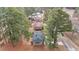 Aerial view of house and surrounding neighborhood with tree coverage at 416 N Cheatham St, Franklinton, NC 27525
