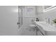 Bathroom with pedestal sink, shower/tub combo, and black and white tile floor at 416 N Cheatham St, Franklinton, NC 27525