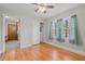 Hardwood floor bedroom with closet and view of kitchen at 416 N Cheatham St, Franklinton, NC 27525