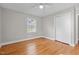 Hardwood floor bedroom with closet and window at 416 N Cheatham St, Franklinton, NC 27525