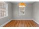 Hardwood floors and neutral walls in dining area at 416 N Cheatham St, Franklinton, NC 27525