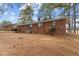 Brick ranch house exterior view with pine straw landscaping at 416 N Cheatham St, Franklinton, NC 27525