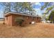 Side view of brick ranch house with landscaping and AC unit at 416 N Cheatham St, Franklinton, NC 27525