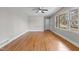 Hardwood floors, neutral walls, and ceiling fan at 416 N Cheatham St, Franklinton, NC 27525