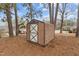 Brown metal storage shed in backyard with pine straw ground cover at 416 N Cheatham St, Franklinton, NC 27525