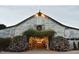 Festively decorated barn entrance with lights and greenery, perfect for holiday events at 4201 Henderson Pl, Pittsboro, NC 27312