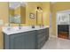 This bathroom features double sinks and a large mirror at 4201 Henderson Pl, Pittsboro, NC 27312