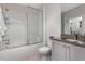 Bathroom featuring tiled shower and glass door enclosure adjacent to sink and vanity at 4201 Henderson Pl, Pittsboro, NC 27312