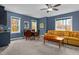 This bonus room is equipped with a table for dining and a sofa for relaxing at 4201 Henderson Pl, Pittsboro, NC 27312