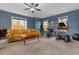 This bonus room is equipped with workout equipment and has a sofa for relaxing at 4201 Henderson Pl, Pittsboro, NC 27312