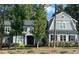 Charming gray two-story home with a well-manicured lawn and mature trees, perfect for a Gathering at 4201 Henderson Pl, Pittsboro, NC 27312