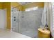 A frameless glass shower features decorative tile and a small window for natural light at 4201 Henderson Pl, Pittsboro, NC 27312