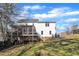 Two-story house with screened porch and deck, a spacious backyard, and a fenced area at 4205 Winding Oak Way, Apex, NC 27539